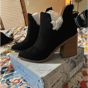 Really cute size 5 booties. Black suede material with brown,square heels.